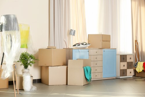 Removal team loading boxes and furniture during a house move