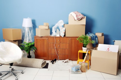 Removal team handling a home move in Hackney street