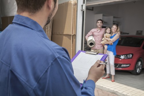 Professional movers loading items in Hackney