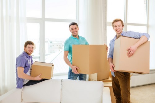 Local removals team helping with household boxes and furniture