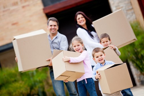 Local removals team handling furniture in Hackney near mixed residential streets