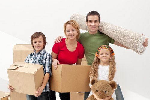 Professional removalists loading furniture for a Hackney house move