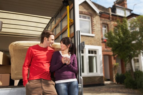 Unpacking boxes and placing household items in a new Hackney property
